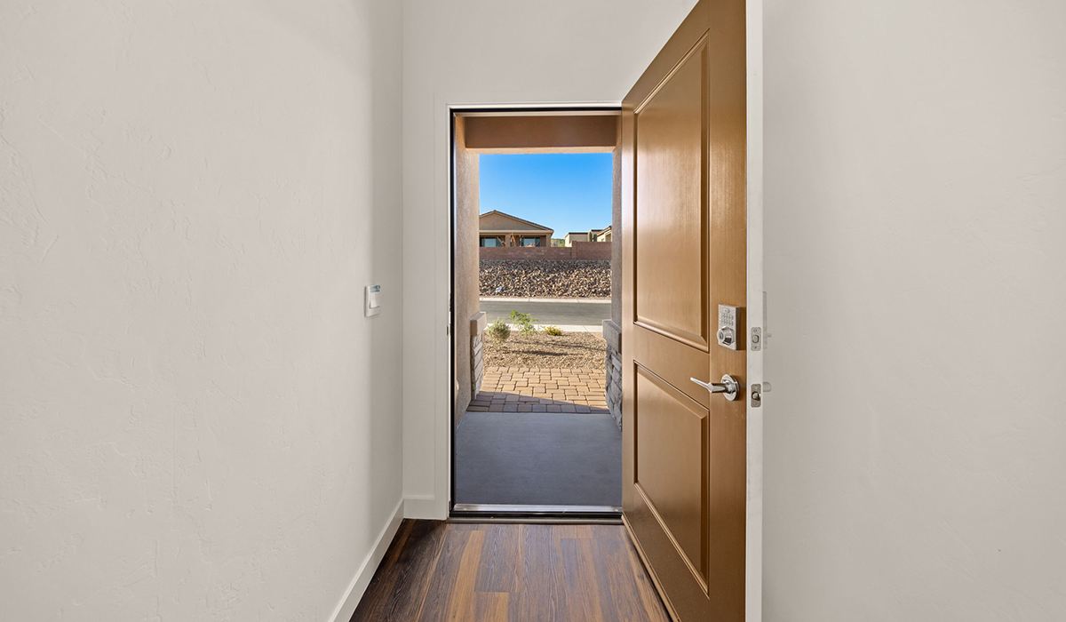 Introducing the Charleston — a beautifully designed new floor plan at Solterra by D.R. Horton in Green Valley. Offering 2,119 square feet of thoughtfully planned living space, the Charleston blends modern convenience with timeless elegance, creating a home that feels both refined and welcoming.  Step through the inviting entryway and into an open-concept layout designed to maximize every square foot. The expansive great room serves as the heart of the home, flowing seamlessly into the dining area and kitchen—ideal for both everyday living and entertaining. The kitchen features a spacious center island, quartz countertops, Shaker-style cabinetry, and a dedicated pantry, delivering a clean, modern aesthetic with ample storage for all your culinary needs.  The Charleston is available in two- and three-bedroom configurations, offering flexibility to meet a variety of lifestyle needs. The primary suite is thoughtfully located at the rear of the home for added privacy and includes a linen closet, walk-in closet, and a well-appointed ensuite bathroom. Near the front of the home is a powder room, guest bedroom with walk-in closet and ensuite bathroom, and study that creates a functional layout for guests, work-from-home needs, or additional living space.  Designed with practicality in mind, the Charleston includes a utility room conveniently located near the kitchen and garage, providing easy access to laundry and additional storage. A wrap around covered back patio extends the living space outdoors and is perfect for enjoying Green Valley’s beautiful year-round weather.  Homes at Solterra showcase elegant, modern interiors paired with distinctive exterior finishes, including sand finish texture stucco, landscaped front yards with auto drip irrigation, and fully fenced backyards. Covered back patios create inviting spaces to relax and take in Green Valley’s breathtaking sunsets. Inside, D.R. Horton’s Home is Connected® Smart Home package enhances everyday living with a smart thermostat, video doorbell, keyless entry, and a Wi-Fi–enabled garage door opener.  Outdoor enthusiasts will appreciate the close proximity to scenic neighborhood parks, Colossal Cave Mountain Park, and an abundance of walking and biking trails that weave throughout Green Valley, making the Charleston a perfect blend of comfort, style, and outdoor living.