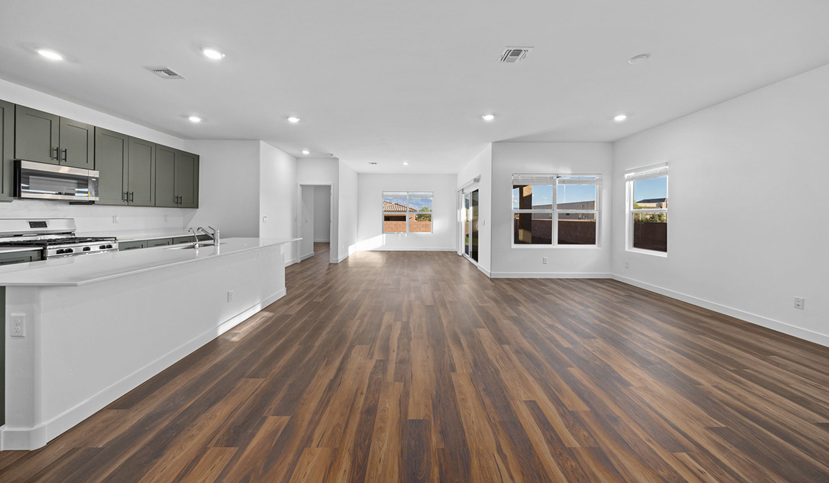 Introducing the Charleston — a beautifully designed new floor plan at Solterra by D.R. Horton in Green Valley. Offering 2,119 square feet of thoughtfully planned living space, the Charleston blends modern convenience with timeless elegance, creating a home that feels both refined and welcoming.  Step through the inviting entryway and into an open-concept layout designed to maximize every square foot. The expansive great room serves as the heart of the home, flowing seamlessly into the dining area and kitchen—ideal for both everyday living and entertaining. The kitchen features a spacious center island, quartz countertops, Shaker-style cabinetry, and a dedicated pantry, delivering a clean, modern aesthetic with ample storage for all your culinary needs.  The Charleston is available in two- and three-bedroom configurations, offering flexibility to meet a variety of lifestyle needs. The primary suite is thoughtfully located at the rear of the home for added privacy and includes a linen closet, walk-in closet, and a well-appointed ensuite bathroom. Near the front of the home is a powder room, guest bedroom with walk-in closet and ensuite bathroom, and study that creates a functional layout for guests, work-from-home needs, or additional living space.  Designed with practicality in mind, the Charleston includes a utility room conveniently located near the kitchen and garage, providing easy access to laundry and additional storage. A wrap around covered back patio extends the living space outdoors and is perfect for enjoying Green Valley’s beautiful year-round weather.  Homes at Solterra showcase elegant, modern interiors paired with distinctive exterior finishes, including sand finish texture stucco, landscaped front yards with auto drip irrigation, and fully fenced backyards. Covered back patios create inviting spaces to relax and take in Green Valley’s breathtaking sunsets. Inside, D.R. Horton’s Home is Connected® Smart Home package enhances everyday living with a smart thermostat, video doorbell, keyless entry, and a Wi-Fi–enabled garage door opener.  Outdoor enthusiasts will appreciate the close proximity to scenic neighborhood parks, Colossal Cave Mountain Park, and an abundance of walking and biking trails that weave throughout Green Valley, making the Charleston a perfect blend of comfort, style, and outdoor living.