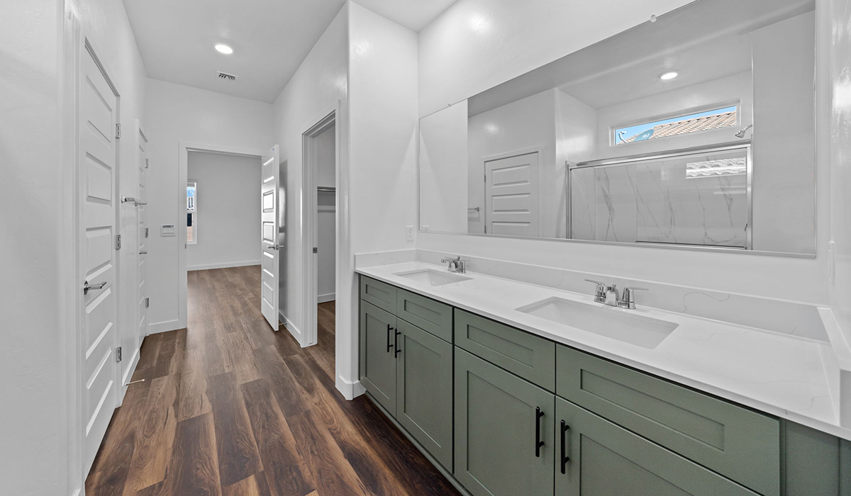 Introducing the Charleston — a beautifully designed new floor plan at Solterra by D.R. Horton in Green Valley. Offering 2,119 square feet of thoughtfully planned living space, the Charleston blends modern convenience with timeless elegance, creating a home that feels both refined and welcoming.  Step through the inviting entryway and into an open-concept layout designed to maximize every square foot. The expansive great room serves as the heart of the home, flowing seamlessly into the dining area and kitchen—ideal for both everyday living and entertaining. The kitchen features a spacious center island, quartz countertops, Shaker-style cabinetry, and a dedicated pantry, delivering a clean, modern aesthetic with ample storage for all your culinary needs.  The Charleston is available in two- and three-bedroom configurations, offering flexibility to meet a variety of lifestyle needs. The primary suite is thoughtfully located at the rear of the home for added privacy and includes a linen closet, walk-in closet, and a well-appointed ensuite bathroom. Near the front of the home is a powder room, guest bedroom with walk-in closet and ensuite bathroom, and study that creates a functional layout for guests, work-from-home needs, or additional living space.  Designed with practicality in mind, the Charleston includes a utility room conveniently located near the kitchen and garage, providing easy access to laundry and additional storage. A wrap around covered back patio extends the living space outdoors and is perfect for enjoying Green Valley’s beautiful year-round weather.  Homes at Solterra showcase elegant, modern interiors paired with distinctive exterior finishes, including sand finish texture stucco, landscaped front yards with auto drip irrigation, and fully fenced backyards. Covered back patios create inviting spaces to relax and take in Green Valley’s breathtaking sunsets. Inside, D.R. Horton’s Home is Connected® Smart Home package enhances everyday living with a smart thermostat, video doorbell, keyless entry, and a Wi-Fi–enabled garage door opener.  Outdoor enthusiasts will appreciate the close proximity to scenic neighborhood parks, Colossal Cave Mountain Park, and an abundance of walking and biking trails that weave throughout Green Valley, making the Charleston a perfect blend of comfort, style, and outdoor living.