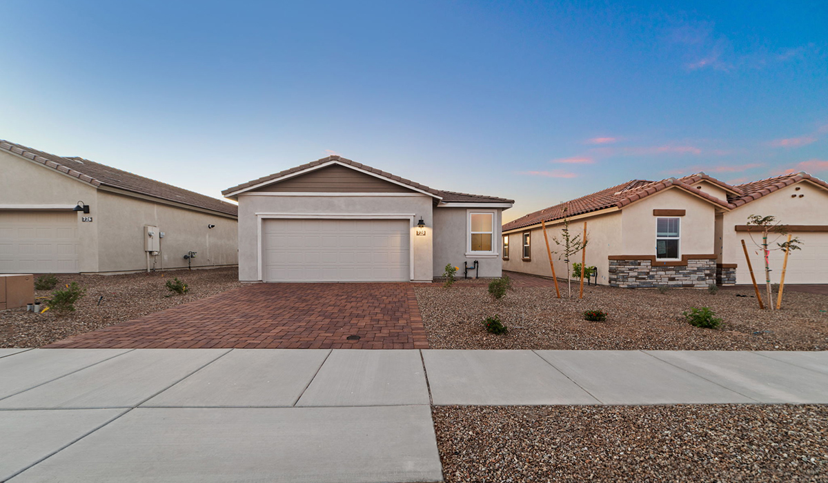 Welcome to The Aloe, a thoughtfully designed new floor plan at Entrada Del Toro, within the master-planned community of Rancho Sahuarita. Offering 1,310 square feet of efficient and comfortable living space, The Aloe is ideal for those seeking a home that blends functionality, modern style, and everyday ease.  Upon entry, you’re welcomed into an open-concept layout that maximizes every square foot. The large great room serves as the heart of the home and flows seamlessly into the dining area and kitchen—perfect for both relaxing and entertaining. The kitchen is beautifully appointed with a central island, quartz countertops, Shaker-style cabinetry, and a dedicated pantry, creating a clean, modern aesthetic with ample storage and workspace.  The Aloe features three well-proportioned bedrooms designed for comfort and flexibility. The private primary suite is tucked away at the rear of the home and includes a walk-in closet and en-suite bathroom. Two additional bedrooms are located near the front of the home.  Designed with convenience in mind, the home includes a utility room near the kitchen, offering easy access to laundry and additional storage. A covered back patio extends the living space outdoors, providing the perfect setting to enjoy Sahuarita’s beautiful weather and scenic surroundings.  Residents of Entrada Del Toro enjoy access to Rancho Sahuarita’s extensive resort-style amenities, including a full-service fitness center, multiple swimming pools, pickleball courts, splash pads, playgrounds, and expansive parks designed for all ages and lifestyles. Homeowners will also have exclusive access to the brand-new Entrada Del Toro Community Center, scheduled to open in Spring 2026, featuring modern gathering spaces and recreational amenities just steps from home.
