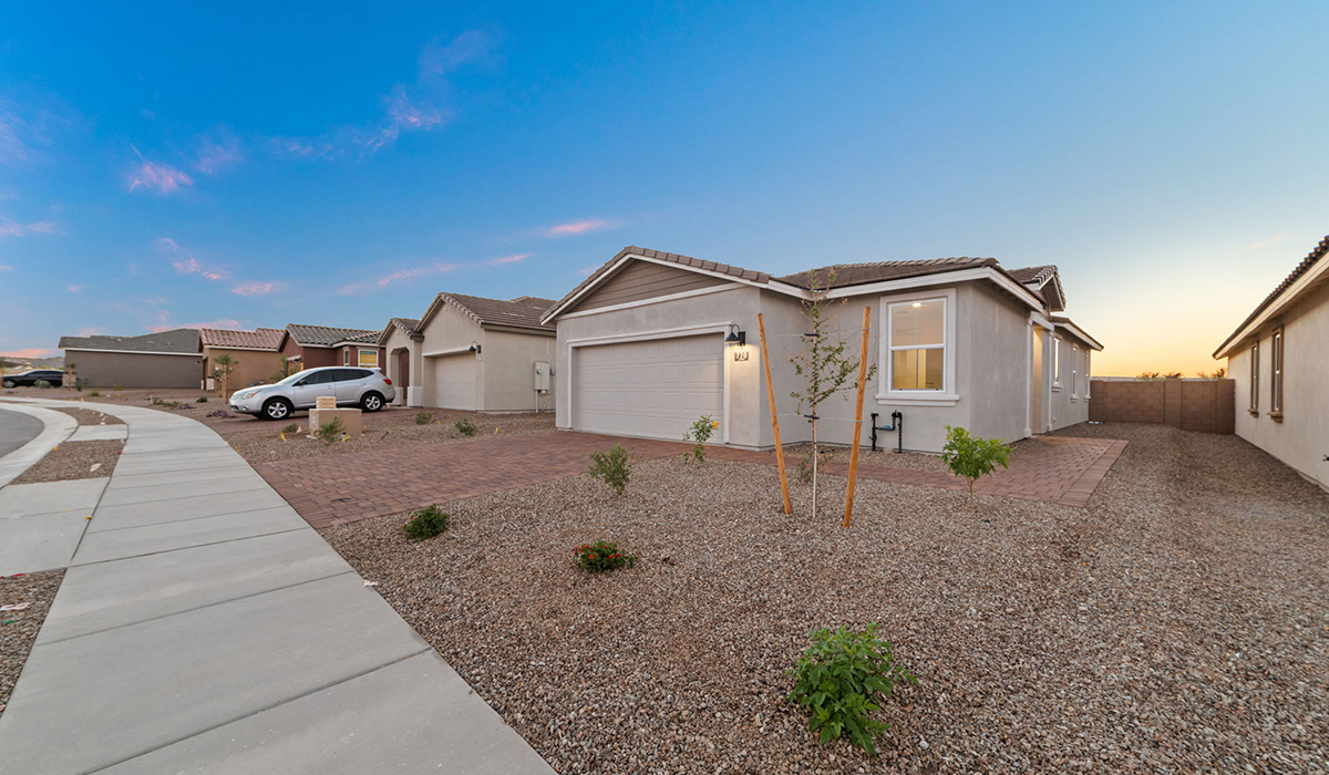 Welcome to The Aloe, a thoughtfully designed new floor plan at Entrada Del Toro, within the master-planned community of Rancho Sahuarita. Offering 1,310 square feet of efficient and comfortable living space, The Aloe is ideal for those seeking a home that blends functionality, modern style, and everyday ease.  Upon entry, you’re welcomed into an open-concept layout that maximizes every square foot. The large great room serves as the heart of the home and flows seamlessly into the dining area and kitchen—perfect for both relaxing and entertaining. The kitchen is beautifully appointed with a central island, quartz countertops, Shaker-style cabinetry, and a dedicated pantry, creating a clean, modern aesthetic with ample storage and workspace.  The Aloe features three well-proportioned bedrooms designed for comfort and flexibility. The private primary suite is tucked away at the rear of the home and includes a walk-in closet and en-suite bathroom. Two additional bedrooms are located near the front of the home.  Designed with convenience in mind, the home includes a utility room near the kitchen, offering easy access to laundry and additional storage. A covered back patio extends the living space outdoors, providing the perfect setting to enjoy Sahuarita’s beautiful weather and scenic surroundings.  Residents of Entrada Del Toro enjoy access to Rancho Sahuarita’s extensive resort-style amenities, including a full-service fitness center, multiple swimming pools, pickleball courts, splash pads, playgrounds, and expansive parks designed for all ages and lifestyles. Homeowners will also have exclusive access to the brand-new Entrada Del Toro Community Center, scheduled to open in Spring 2026, featuring modern gathering spaces and recreational amenities just steps from home.  *Images shown are for reference only. They depict The Aloe spec home and may not represent the actual home.