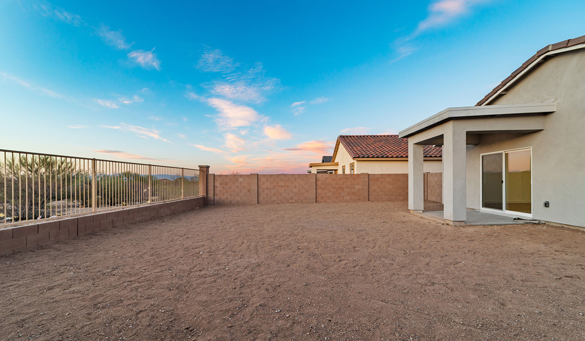 Welcome to The Aloe, a thoughtfully designed new floor plan at Entrada Del Toro, within the master-planned community of Rancho Sahuarita. Offering 1,310 square feet of efficient and comfortable living space, The Aloe is ideal for those seeking a home that blends functionality, modern style, and everyday ease.  Upon entry, you’re welcomed into an open-concept layout that maximizes every square foot. The large great room serves as the heart of the home and flows seamlessly into the dining area and kitchen—perfect for both relaxing and entertaining. The kitchen is beautifully appointed with a central island, quartz countertops, Shaker-style cabinetry, and a dedicated pantry, creating a clean, modern aesthetic with ample storage and workspace.  The Aloe features three well-proportioned bedrooms designed for comfort and flexibility. The private primary suite is tucked away at the rear of the home and includes a walk-in closet and en-suite bathroom. Two additional bedrooms are located near the front of the home.  Designed with convenience in mind, the home includes a utility room near the kitchen, offering easy access to laundry and additional storage. A covered back patio extends the living space outdoors, providing the perfect setting to enjoy Sahuarita’s beautiful weather and scenic surroundings.  Residents of Entrada Del Toro enjoy access to Rancho Sahuarita’s extensive resort-style amenities, including a full-service fitness center, multiple swimming pools, pickleball courts, splash pads, playgrounds, and expansive parks designed for all ages and lifestyles. Homeowners will also have exclusive access to the brand-new Entrada Del Toro Community Center, scheduled to open in Spring 2026, featuring modern gathering spaces and recreational amenities just steps from home.  *Images shown are for reference only. They depict The Aloe spec home and may not represent the actual home.