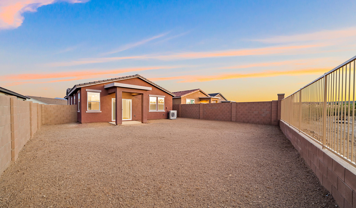 Welcome to The Aloe, a thoughtfully designed new floor plan at Entrada Del Toro, within the master-planned community of Rancho Sahuarita. Offering 1,310 square feet of efficient and comfortable living space, The Aloe is ideal for those seeking a home that blends functionality, modern style, and everyday ease.  Upon entry, you’re welcomed into an open-concept layout that maximizes every square foot. The large great room serves as the heart of the home and flows seamlessly into the dining area and kitchen—perfect for both relaxing and entertaining. The kitchen is beautifully appointed with a central island, quartz countertops, Shaker-style cabinetry, and a dedicated pantry, creating a clean, modern aesthetic with ample storage and workspace.  The Aloe features three well-proportioned bedrooms designed for comfort and flexibility. The private primary suite is tucked away at the rear of the home and includes a walk-in closet and en-suite bathroom. Two additional bedrooms are located near the front of the home.  Designed with convenience in mind, the home includes a utility room near the kitchen, offering easy access to laundry and additional storage. A covered back patio extends the living space outdoors, providing the perfect setting to enjoy Sahuarita’s beautiful weather and scenic surroundings.  Residents of Entrada Del Toro enjoy access to Rancho Sahuarita’s extensive resort-style amenities, including a full-service fitness center, multiple swimming pools, pickleball courts, splash pads, playgrounds, and expansive parks designed for all ages and lifestyles. Homeowners will also have exclusive access to the brand-new Entrada Del Toro Community Center, scheduled to open in Spring 2026, featuring modern gathering spaces and recreational amenities just steps from home.  *Images shown are for reference only. They depict The Aloe spec home and may not represent the actual home.