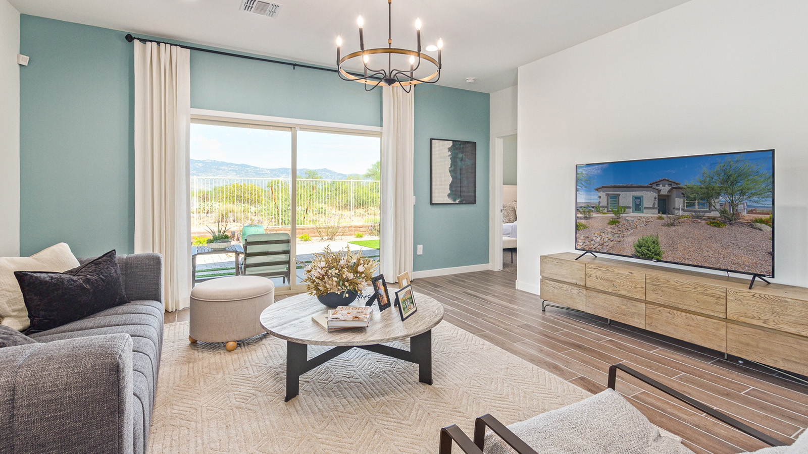 Introducing the Gaven at Entrada Del Toro  The Gaven is a beautifully designed single-story home located in the highly desirable Entrada Del Toro neighborhood within the master-planned community of Rancho Sahuarita. Offering 1,945 square feet of thoughtfully planned living space, this inviting home features four bedrooms, two full bathrooms, a covered back patio, and a two-car garage—perfect for households seeking comfort, functionality, and room to grow.  From the moment you enter, the welcoming entryway opens into an expansive open-concept layout that seamlessly connects the great room, dining area, and kitchen—creating a space ideal for everyday living and effortless entertaining. The kitchen is a true centerpiece, complete with a large center island, Shaker-style cabinetry, quartz countertops, a walk-in pantry, and ample storage. Abundant natural light enhances the home’s warm and welcoming atmosphere throughout.  The Gaven offers a thoughtfully arranged split-bedroom design, with three secondary bedrooms located near the front of the home, providing flexibility for guests, home offices, or hobbies. Tucked away for privacy, the spacious primary suite serves as a peaceful retreat and features an en-suite bathroom and a generous walk-in closet.  Homes at Entrada Del Toro are designed with the future in mind. Exterior features include a light lace stucco finish, professionally landscaped front yards with automatic drip irrigation, and large, fully fenced backyards ready for your personal touch. Inside, the Home is Connected® Smart Home package delivers modern convenience with a smart thermostat, video doorbell, keyless entry, and a Wi-Fi® enabled garage door opener.  With its spacious living areas, flexible bedroom layout, and thoughtful design throughout, the Gaven offers the perfect blend of comfort, convenience, and livability.  Residents of Entrada Del Toro enjoy access to Rancho Sahuarita’s extensive amenities, including a full-service fitness center, multiple resort-style swimming pools, pickleball courts, splash pads, playgrounds, and expansive parks designed for all ages and lifestyles. Homeowners will also have exclusive access to the brand-new Entrada Del Toro Community Center, scheduled to open in Spring 2026, offering modern gathering spaces and recreational features just moments from home.