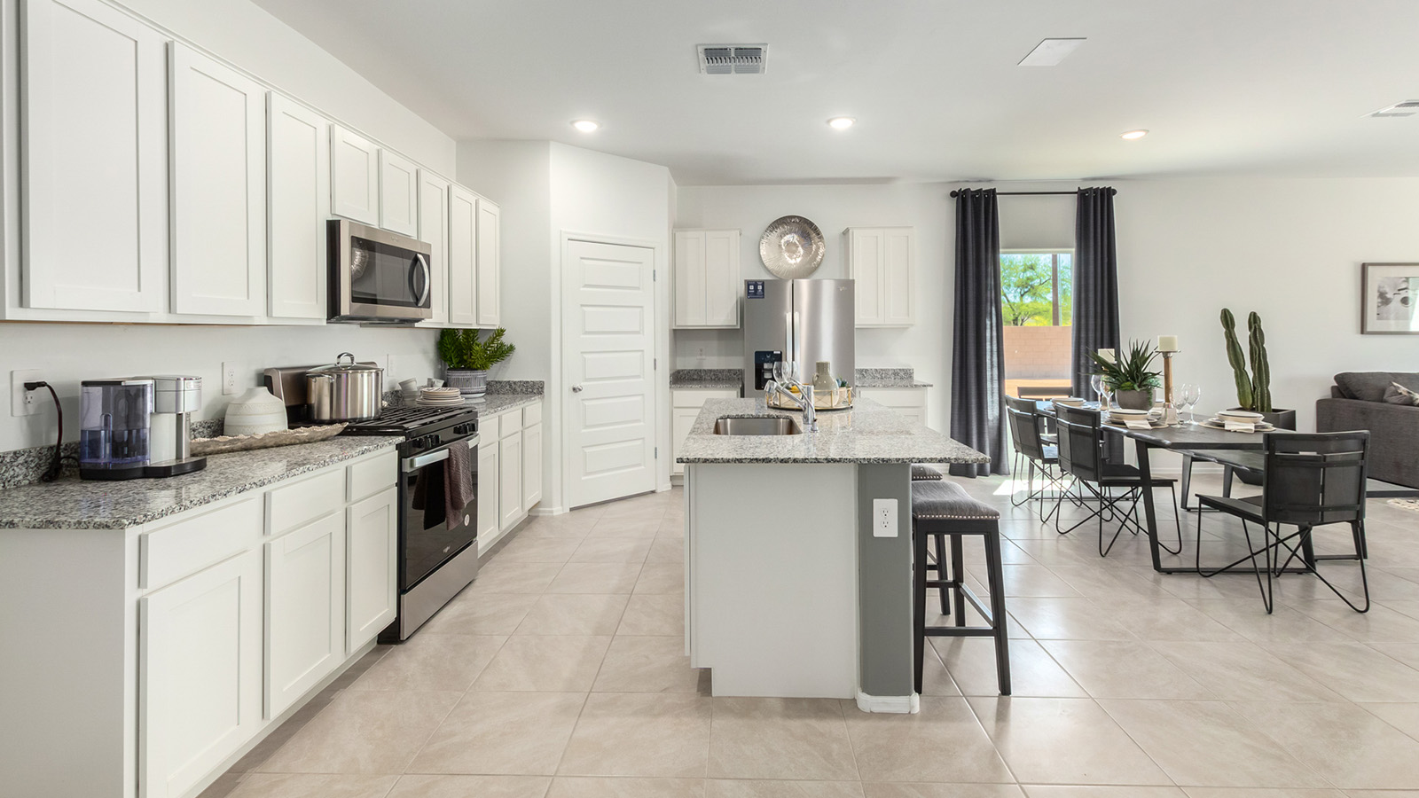 Introducing the Gaven at Entrada Del Toro  The Gaven is a beautifully designed single-story home located in the highly desirable Entrada Del Toro neighborhood within the master-planned community of Rancho Sahuarita. Offering 1,945 square feet of thoughtfully planned living space, this inviting home features four bedrooms, two full bathrooms, a covered back patio, and a two-car garage—perfect for households seeking comfort, functionality, and room to grow.  From the moment you enter, the welcoming entryway opens into an expansive open-concept layout that seamlessly connects the great room, dining area, and kitchen—creating a space ideal for everyday living and effortless entertaining. The kitchen is a true centerpiece, complete with a large center island, Shaker-style cabinetry, quartz countertops, a walk-in pantry, and ample storage. Abundant natural light enhances the home’s warm and welcoming atmosphere throughout.  The Gaven offers a thoughtfully arranged split-bedroom design, with three secondary bedrooms located near the front of the home, providing flexibility for guests, home offices, or hobbies. Tucked away for privacy, the spacious primary suite serves as a peaceful retreat and features an en-suite bathroom and a generous walk-in closet.  Homes at Entrada Del Toro are designed with the future in mind. Exterior features include a light lace stucco finish, professionally landscaped front yards with automatic drip irrigation, and large, fully fenced backyards ready for your personal touch. Inside, the Home is Connected® Smart Home package delivers modern convenience with a smart thermostat, video doorbell, keyless entry, and a Wi-Fi® enabled garage door opener.  With its spacious living areas, flexible bedroom layout, and thoughtful design throughout, the Gaven offers the perfect blend of comfort, convenience, and livability.  Residents of Entrada Del Toro enjoy access to Rancho Sahuarita’s extensive amenities, including a full-service fitness center, multiple resort-style swimming pools, pickleball courts, splash pads, playgrounds, and expansive parks designed for all ages and lifestyles. Homeowners will also have exclusive access to the brand-new Entrada Del Toro Community Center, scheduled to open in Spring 2026, offering modern gathering spaces and recreational features just moments from home.  *Images shown are for reference only. They depict the Gaven model home and may not represent the actual home.