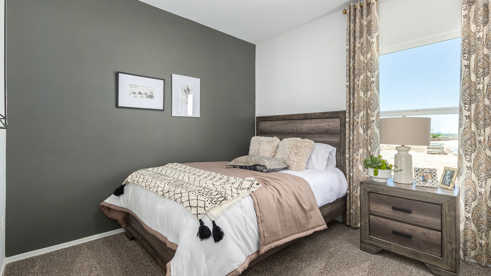 Introducing the Gaven at Entrada Del Toro  The Gaven is a beautifully designed single-story home located in the highly desirable Entrada Del Toro neighborhood within the master-planned community of Rancho Sahuarita. Offering 1,945 square feet of thoughtfully planned living space, this inviting home features four bedrooms, two full bathrooms, a covered back patio, and a two-car garage—perfect for households seeking comfort, functionality, and room to grow.  From the moment you enter, the welcoming entryway opens into an expansive open-concept layout that seamlessly connects the great room, dining area, and kitchen—creating a space ideal for everyday living and effortless entertaining. The kitchen is a true centerpiece, complete with a large center island, Shaker-style cabinetry, quartz countertops, a walk-in pantry, and ample storage. Abundant natural light enhances the home’s warm and welcoming atmosphere throughout.  The Gaven offers a thoughtfully arranged split-bedroom design, with three secondary bedrooms located near the front of the home, providing flexibility for guests, home offices, or hobbies. Tucked away for privacy, the spacious primary suite serves as a peaceful retreat and features an en-suite bathroom and a generous walk-in closet.  Homes at Entrada Del Toro are designed with the future in mind. Exterior features include a light lace stucco finish, professionally landscaped front yards with automatic drip irrigation, and large, fully fenced backyards ready for your personal touch. Inside, the Home is Connected® Smart Home package delivers modern convenience with a smart thermostat, video doorbell, keyless entry, and a Wi-Fi® enabled garage door opener.  With its spacious living areas, flexible bedroom layout, and thoughtful design throughout, the Gaven offers the perfect blend of comfort, convenience, and livability.  Residents of Entrada Del Toro enjoy access to Rancho Sahuarita’s extensive amenities, including a full-service fitness center, multiple resort-style swimming pools, pickleball courts, splash pads, playgrounds, and expansive parks designed for all ages and lifestyles. Homeowners will also have exclusive access to the brand-new Entrada Del Toro Community Center, scheduled to open in Spring 2026, offering modern gathering spaces and recreational features just moments from home.  *Images shown are for reference only. They depict the Gaven model home and may not represent the actual home.