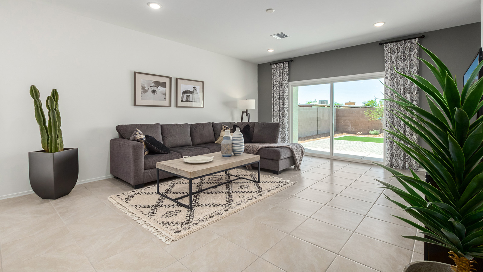 Introducing the Gaven at Entrada Del Toro  The Gaven is a beautifully designed single-story home located in the highly desirable Entrada Del Toro neighborhood within the master-planned community of Rancho Sahuarita. Offering 1,945 square feet of thoughtfully planned living space, this inviting home features four bedrooms, two full bathrooms, a covered back patio, and a two-car garage—perfect for households seeking comfort, functionality, and room to grow.  From the moment you enter, the welcoming entryway opens into an expansive open-concept layout that seamlessly connects the great room, dining area, and kitchen—creating a space ideal for everyday living and effortless entertaining. The kitchen is a true centerpiece, complete with a large center island, Shaker-style cabinetry, quartz countertops, a walk-in pantry, and ample storage. Abundant natural light enhances the home’s warm and welcoming atmosphere throughout.  The Gaven offers a thoughtfully arranged split-bedroom design, with three secondary bedrooms located near the front of the home, providing flexibility for guests, home offices, or hobbies. Tucked away for privacy, the spacious primary suite serves as a peaceful retreat and features an en-suite bathroom and a generous walk-in closet.  Homes at Entrada Del Toro are designed with the future in mind. Exterior features include a light lace stucco finish, professionally landscaped front yards with automatic drip irrigation, and large, fully fenced backyards ready for your personal touch. Inside, the Home is Connected® Smart Home package delivers modern convenience with a smart thermostat, video doorbell, keyless entry, and a Wi-Fi® enabled garage door opener.  With its spacious living areas, flexible bedroom layout, and thoughtful design throughout, the Gaven offers the perfect blend of comfort, convenience, and livability.  Residents of Entrada Del Toro enjoy access to Rancho Sahuarita’s extensive amenities, including a full-service fitness center, multiple resort-style swimming pools, pickleball courts, splash pads, playgrounds, and expansive parks designed for all ages and lifestyles. Homeowners will also have exclusive access to the brand-new Entrada Del Toro Community Center, scheduled to open in Spring 2026, offering modern gathering spaces and recreational features just moments from home.  *Images shown are for reference only. They depict The Gaven model home and may not represent the actual home.