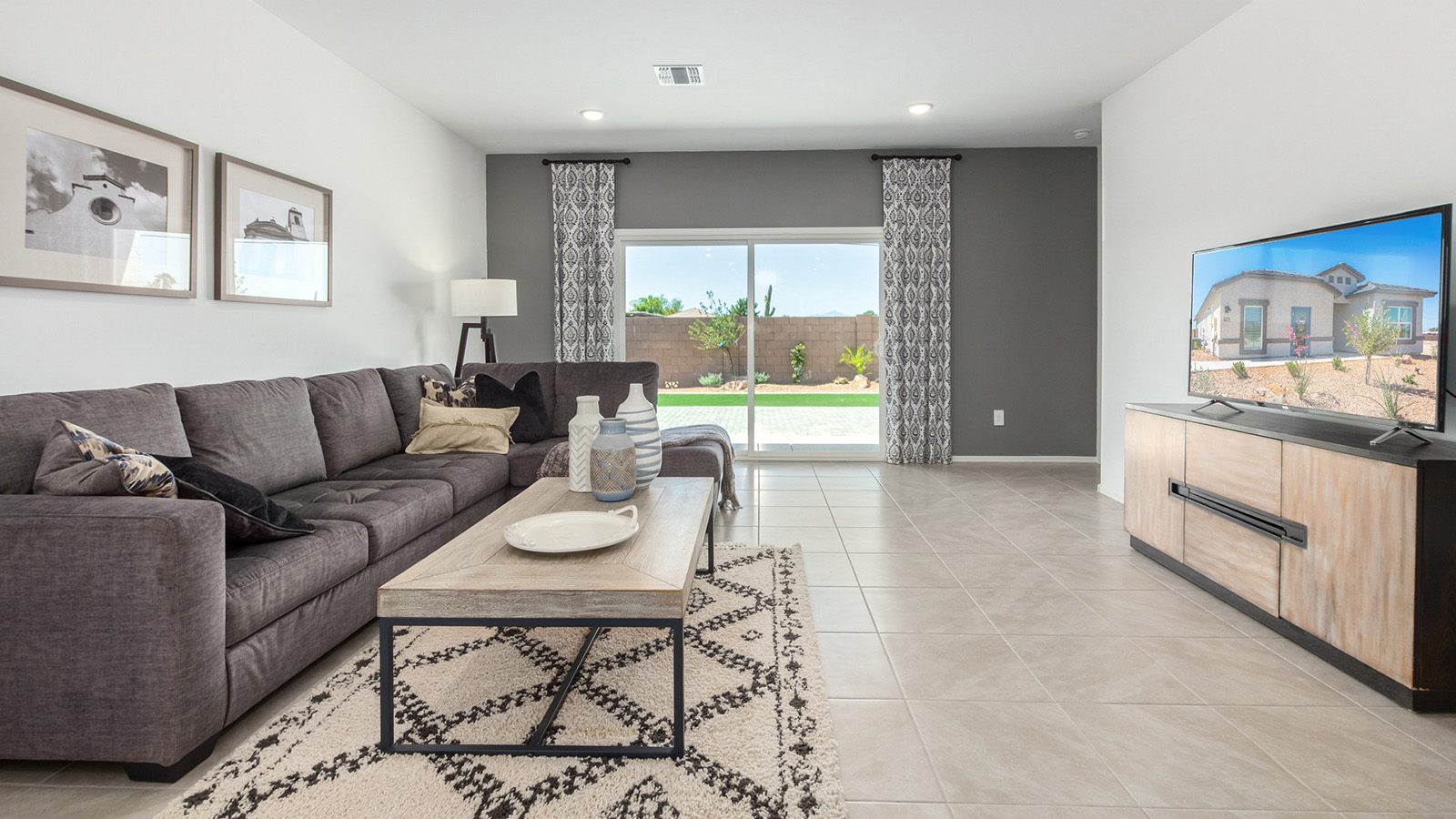 Introducing the Gaven at Entrada Del Toro  The Gaven is a beautifully designed single-story home located in the highly desirable Entrada Del Toro neighborhood within the master-planned community of Rancho Sahuarita. Offering 1,945 square feet of thoughtfully planned living space, this inviting home features four bedrooms, two full bathrooms, a covered back patio, and a two-car garage—perfect for households seeking comfort, functionality, and room to grow.  From the moment you enter, the welcoming entryway opens into an expansive open-concept layout that seamlessly connects the great room, dining area, and kitchen—creating a space ideal for everyday living and effortless entertaining. The kitchen is a true centerpiece, complete with a large center island, Shaker-style cabinetry, quartz countertops, a walk-in pantry, and ample storage. Abundant natural light enhances the home’s warm and welcoming atmosphere throughout.  The Gaven offers a thoughtfully arranged split-bedroom design, with three secondary bedrooms located near the front of the home, providing flexibility for guests, home offices, or hobbies. Tucked away for privacy, the spacious primary suite serves as a peaceful retreat and features an en-suite bathroom and a generous walk-in closet.  Homes at Entrada Del Toro are designed with the future in mind. Exterior features include a light lace stucco finish, professionally landscaped front yards with automatic drip irrigation, and large, fully fenced backyards ready for your personal touch. Inside, the Home is Connected® Smart Home package delivers modern convenience with a smart thermostat, video doorbell, keyless entry, and a Wi-Fi® enabled garage door opener.  With its spacious living areas, flexible bedroom layout, and thoughtful design throughout, the Gaven offers the perfect blend of comfort, convenience, and livability.  Residents of Entrada Del Toro enjoy access to Rancho Sahuarita’s extensive amenities, including a full-service fitness center, multiple resort-style swimming pools, pickleball courts, splash pads, playgrounds, and expansive parks designed for all ages and lifestyles. Homeowners will also have exclusive access to the brand-new Entrada Del Toro Community Center, scheduled to open in Spring 2026, offering modern gathering spaces and recreational features just moments from home.  *Images shown are for reference only. They depict The Gaven model home and may not represent the actual home.