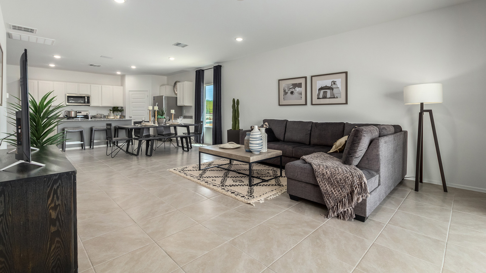 Introducing the Gaven at Entrada Del Toro  The Gaven is a beautifully designed single-story home located in the highly desirable Entrada Del Toro neighborhood within the master-planned community of Rancho Sahuarita. Offering 1,945 square feet of thoughtfully planned living space, this inviting home features four bedrooms, two full bathrooms, a covered back patio, and a two-car garage—perfect for households seeking comfort, functionality, and room to grow.  From the moment you enter, the welcoming entryway opens into an expansive open-concept layout that seamlessly connects the great room, dining area, and kitchen—creating a space ideal for everyday living and effortless entertaining. The kitchen is a true centerpiece, complete with a large center island, Shaker-style cabinetry, quartz countertops, a walk-in pantry, and ample storage. Abundant natural light enhances the home’s warm and welcoming atmosphere throughout.  The Gaven offers a thoughtfully arranged split-bedroom design, with three secondary bedrooms located near the front of the home, providing flexibility for guests, home offices, or hobbies. Tucked away for privacy, the spacious primary suite serves as a peaceful retreat and features an en-suite bathroom and a generous walk-in closet.  Homes at Entrada Del Toro are designed with the future in mind. Exterior features include a light lace stucco finish, professionally landscaped front yards with automatic drip irrigation, and large, fully fenced backyards ready for your personal touch. Inside, the Home is Connected® Smart Home package delivers modern convenience with a smart thermostat, video doorbell, keyless entry, and a Wi-Fi® enabled garage door opener.  With its spacious living areas, flexible bedroom layout, and thoughtful design throughout, the Gaven offers the perfect blend of comfort, convenience, and livability.  Residents of Entrada Del Toro enjoy access to Rancho Sahuarita’s extensive amenities, including a full-service fitness center, multiple resort-style swimming pools, pickleball courts, splash pads, playgrounds, and expansive parks designed for all ages and lifestyles. Homeowners will also have exclusive access to the brand-new Entrada Del Toro Community Center, scheduled to open in Spring 2026, offering modern gathering spaces and recreational features just moments from home.  *Images shown are for reference only. They depict The Gaven model home and may not represent the actual home.