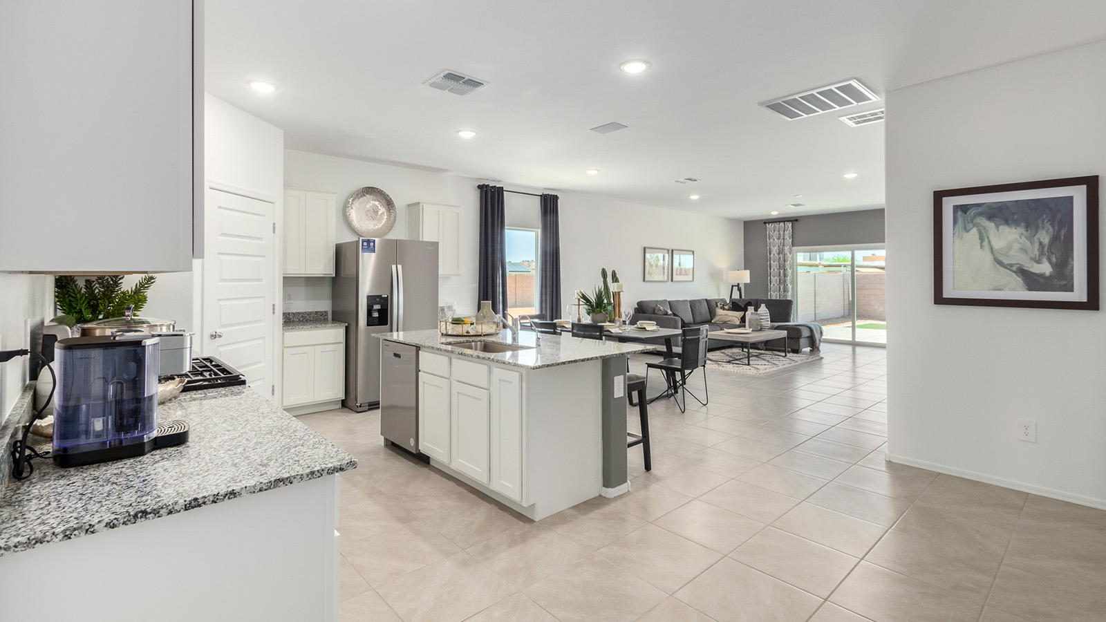 Introducing the Gaven at Entrada Del Toro  The Gaven is a beautifully designed single-story home located in the highly desirable Entrada Del Toro neighborhood within the master-planned community of Rancho Sahuarita. Offering 1,945 square feet of thoughtfully planned living space, this inviting home features four bedrooms, two full bathrooms, a covered back patio, and a two-car garage—perfect for households seeking comfort, functionality, and room to grow.  From the moment you enter, the welcoming entryway opens into an expansive open-concept layout that seamlessly connects the great room, dining area, and kitchen—creating a space ideal for everyday living and effortless entertaining. The kitchen is a true centerpiece, complete with a large center island, Shaker-style cabinetry, quartz countertops, a walk-in pantry, and ample storage. Abundant natural light enhances the home’s warm and welcoming atmosphere throughout.  The Gaven offers a thoughtfully arranged split-bedroom design, with three secondary bedrooms located near the front of the home, providing flexibility for guests, home offices, or hobbies. Tucked away for privacy, the spacious primary suite serves as a peaceful retreat and features an en-suite bathroom and a generous walk-in closet.  Homes at Entrada Del Toro are designed with the future in mind. Exterior features include a light lace stucco finish, professionally landscaped front yards with automatic drip irrigation, and large, fully fenced backyards ready for your personal touch. Inside, the Home is Connected® Smart Home package delivers modern convenience with a smart thermostat, video doorbell, keyless entry, and a Wi-Fi® enabled garage door opener.  With its spacious living areas, flexible bedroom layout, and thoughtful design throughout, the Gaven offers the perfect blend of comfort, convenience, and livability.  Residents of Entrada Del Toro enjoy access to Rancho Sahuarita’s extensive amenities, including a full-service fitness center, multiple resort-style swimming pools, pickleball courts, splash pads, playgrounds, and expansive parks designed for all ages and lifestyles. Homeowners will also have exclusive access to the brand-new Entrada Del Toro Community Center, scheduled to open in Spring 2026, offering modern gathering spaces and recreational features just moments from home.  *Images shown are for reference only. They depict The Gaven model home and may not represent the actual home.