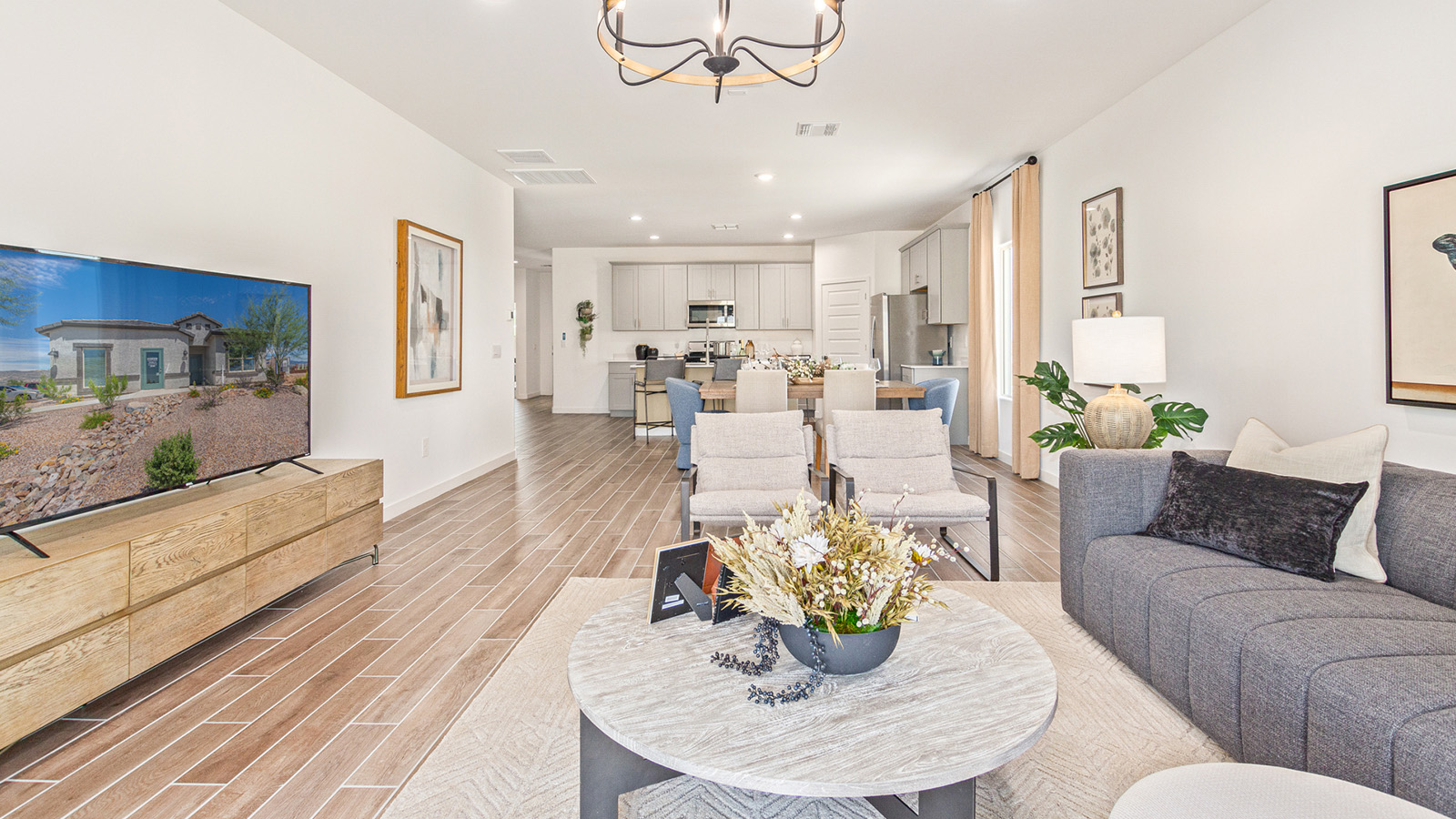 Introducing the Gaven at Entrada Del Toro  The Gaven is a beautifully designed single-story home located in the highly desirable Entrada Del Toro neighborhood within the master-planned community of Rancho Sahuarita. Offering 1,945 square feet of thoughtfully planned living space, this inviting home features four bedrooms, two full bathrooms, a covered back patio, and a two-car garage—perfect for households seeking comfort, functionality, and room to grow.  From the moment you enter, the welcoming entryway opens into an expansive open-concept layout that seamlessly connects the great room, dining area, and kitchen—creating a space ideal for everyday living and effortless entertaining. The kitchen is a true centerpiece, complete with a large center island, Shaker-style cabinetry, quartz countertops, a walk-in pantry, and ample storage. Abundant natural light enhances the home’s warm and welcoming atmosphere throughout.  The Gaven offers a thoughtfully arranged split-bedroom design, with three secondary bedrooms located near the front of the home, providing flexibility for guests, home offices, or hobbies. Tucked away for privacy, the spacious primary suite serves as a peaceful retreat and features an en-suite bathroom and a generous walk-in closet.  Homes at Entrada Del Toro are designed with the future in mind. Exterior features include a light lace stucco finish, professionally landscaped front yards with automatic drip irrigation, and large, fully fenced backyards ready for your personal touch. Inside, the Home is Connected® Smart Home package delivers modern convenience with a smart thermostat, video doorbell, keyless entry, and a Wi-Fi® enabled garage door opener.  With its spacious living areas, flexible bedroom layout, and thoughtful design throughout, the Gaven offers the perfect blend of comfort, convenience, and livability.  Residents of Entrada Del Toro enjoy access to Rancho Sahuarita’s extensive amenities, including a full-service fitness center, multiple resort-style swimming pools, pickleball courts, splash pads, playgrounds, and expansive parks designed for all ages and lifestyles. Homeowners will also have exclusive access to the brand-new Entrada Del Toro Community Center, scheduled to open in Spring 2026, offering modern gathering spaces and recreational features just moments from home.  *Images shown are for reference only. They depict The Gaven sales model home and may not represent the actual home.