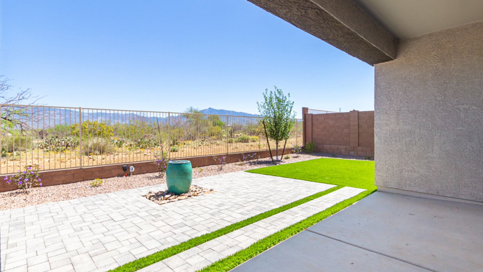 Introducing the Gaven at Entrada Del Toro  The Gaven is a beautifully designed single-story home located in the highly desirable Entrada Del Toro neighborhood within the master-planned community of Rancho Sahuarita. Offering 1,945 square feet of thoughtfully planned living space, this inviting home features four bedrooms, two full bathrooms, a covered back patio, and a two-car garage—perfect for households seeking comfort, functionality, and room to grow.  From the moment you enter, the welcoming entryway opens into an expansive open-concept layout that seamlessly connects the great room, dining area, and kitchen—creating a space ideal for everyday living and effortless entertaining. The kitchen is a true centerpiece, complete with a large center island, Shaker-style cabinetry, quartz countertops, a walk-in pantry, and ample storage. Abundant natural light enhances the home’s warm and welcoming atmosphere throughout.  The Gaven offers a thoughtfully arranged split-bedroom design, with three secondary bedrooms located near the front of the home, providing flexibility for guests, home offices, or hobbies. Tucked away for privacy, the spacious primary suite serves as a peaceful retreat and features an en-suite bathroom and a generous walk-in closet.  Homes at Entrada Del Toro are designed with the future in mind. Exterior features include a light lace stucco finish, professionally landscaped front yards with automatic drip irrigation, and large, fully fenced backyards ready for your personal touch. Inside, the Home is Connected® Smart Home package delivers modern convenience with a smart thermostat, video doorbell, keyless entry, and a Wi-Fi® enabled garage door opener.  With its spacious living areas, flexible bedroom layout, and thoughtful design throughout, the Gaven offers the perfect blend of comfort, convenience, and livability.  Residents of Entrada Del Toro enjoy access to Rancho Sahuarita’s extensive amenities, including a full-service fitness center, multiple resort-style swimming pools, pickleball courts, splash pads, playgrounds, and expansive parks designed for all ages and lifestyles. Homeowners will also have exclusive access to the brand-new Entrada Del Toro Community Center, scheduled to open in Spring 2026, offering modern gathering spaces and recreational features just moments from home.  *Images shown are for reference only. They depict The Gaven sales model home and may not represent the actual home.