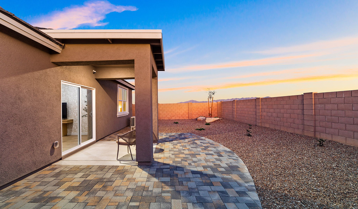 Introducing the Carolina — a thoughtfully designed single-story home offering 1,608 sq. ft. of modern comfort at Entrada Del Toro, a master-planned community in Rancho Sahuarita.  With three bedrooms, two full bathrooms, and a two-car garage, this efficient and beautifully planned layout is perfect for those seeking convenience, comfort, and single-level living.  A welcoming front porch invites you inside, where the entryway opens into a bright and beautifully crafted living space. The heart of the home is the well-appointed kitchen, featuring a large center island, walk-in pantry, and stylish Shaker-style cabinetry. Overlooking the dining area and great room, this open layout makes it easy to cook, gather, and entertain with ease.  The primary bedroom is thoughtfully positioned at the rear of the home, creating a private retreat. Complete with a large en-suite bathroom and walk-in closet, it’s designed for relaxation and convenience.  Two additional bedrooms are located toward the front of the home, offering flexibility for family, guests, a home office, or hobbies, and share a full secondary hallway bathroom.  Our homes at Entrada Del Toro are designed with the future in mind. Each home features a light lace stucco exterior, landscaped front yards with auto drip irrigation, and large backyards that are fully fenced and ready for your personal touch. Inside, the Home is Connected® Smart Home package brings modern convenience to your fingertips with a smart thermostat, video doorbell, keyless entry, and a Wi-Fi® enabled garage door opener.  With its smart layout, modern features, and effortless single-story living, the Carolina brings comfort and functionality together in a one beautifully designed home here at Entrada Del Toro.  Residents of Entrada Del Toro will enjoy access to Rancho Sahuarita’s extensive amenity offerings, which include a full-service fitness center, multiple large swimming pools, pickle-ball courts, splash pads, playgrounds, and sizable parks and recreational spaces designed for all ages and lifestyles. In addition, homeowners will have exclusive access to the brand-new Entrada Del Toro Community Center, scheduled to open Spring 2026, further enhancing the neighborhood experience with modern gathering and recreational spaces close to home.  *Images shown are for reference only. They depict The Carolina sales model home and may not represent the actual home.