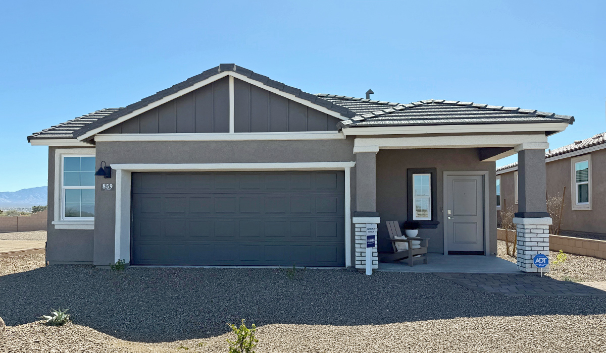 Introducing the Carolina — a thoughtfully designed single-story home offering 1,608 sq. ft. of modern comfort at Entrada Del Toro, a master-planned community in Rancho Sahuarita.  With three bedrooms, two full bathrooms, and a two-car garage, this efficient and beautifully planned layout is perfect for those seeking convenience, comfort, and single-level living.  A welcoming front porch invites you inside, where the entryway opens into a bright and beautifully crafted living space. The heart of the home is the well-appointed kitchen, featuring a large center island, walk-in pantry, and stylish Shaker-style cabinetry. Overlooking the dining area and great room, this open layout makes it easy to cook, gather, and entertain with ease.  The primary bedroom is thoughtfully positioned at the rear of the home, creating a private retreat. Complete with a large en-suite bathroom and walk-in closet, it’s designed for relaxation and convenience.  Two additional bedrooms are located toward the front of the home, offering flexibility for family, guests, a home office, or hobbies, and share a full secondary hallway bathroom.  Our homes at Entrada Del Toro are designed with the future in mind. Each home features a light lace stucco exterior, landscaped front yards with auto drip irrigation, and large backyards that are fully fenced and ready for your personal touch. Inside, the Home is Connected® Smart Home package brings modern convenience to your fingertips with a smart thermostat, video doorbell, keyless entry, and a Wi-Fi® enabled garage door opener.  With its smart layout, modern features, and effortless single-story living, the Carolina brings comfort and functionality together in a one beautifully designed home here at Entrada Del Toro.  Residents of Entrada Del Toro will enjoy access to Rancho Sahuarita’s extensive amenity offerings, which include a full-service fitness center, multiple large swimming pools, pickle-ball courts, splash pads, playgrounds, and sizable parks and recreational spaces designed for all ages and lifestyles. In addition, homeowners will have exclusive access to the brand-new Entrada Del Toro Community Center, scheduled to open Spring 2026, further enhancing the neighborhood experience with modern gathering and recreational spaces close to home.