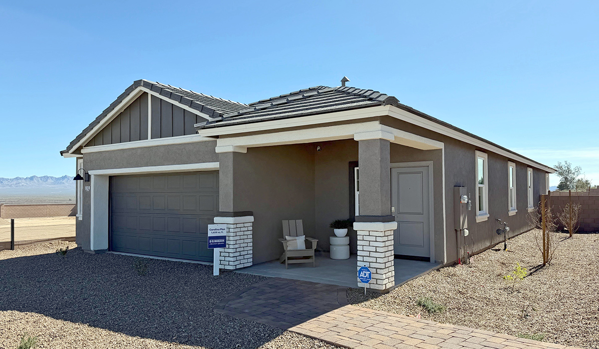 Introducing the Carolina — a thoughtfully designed single-story home offering 1,608 sq. ft. of modern comfort at Entrada Del Toro, a master-planned community in Rancho Sahuarita.  With three bedrooms, two full bathrooms, and a two-car garage, this efficient and beautifully planned layout is perfect for those seeking convenience, comfort, and single-level living.  A welcoming front porch invites you inside, where the entryway opens into a bright and beautifully crafted living space. The heart of the home is the well-appointed kitchen, featuring a large center island, walk-in pantry, and stylish Shaker-style cabinetry. Overlooking the dining area and great room, this open layout makes it easy to cook, gather, and entertain with ease.  The primary bedroom is thoughtfully positioned at the rear of the home, creating a private retreat. Complete with a large en-suite bathroom and walk-in closet, it’s designed for relaxation and convenience.  Two additional bedrooms are located toward the front of the home, offering flexibility for family, guests, a home office, or hobbies, and share a full secondary hallway bathroom.  Our homes at Entrada Del Toro are designed with the future in mind. Each home features a light lace stucco exterior, landscaped front yards with auto drip irrigation, and large backyards that are fully fenced and ready for your personal touch. Inside, the Home is Connected® Smart Home package brings modern convenience to your fingertips with a smart thermostat, video doorbell, keyless entry, and a Wi-Fi® enabled garage door opener.  With its smart layout, modern features, and effortless single-story living, the Carolina brings comfort and functionality together in a one beautifully designed home here at Entrada Del Toro.  Residents of Entrada Del Toro will enjoy access to Rancho Sahuarita’s extensive amenity offerings, which include a full-service fitness center, multiple large swimming pools, pickle-ball courts, splash pads, playgrounds, and sizable parks and recreational spaces designed for all ages and lifestyles. In addition, homeowners will have exclusive access to the brand-new Entrada Del Toro Community Center, scheduled to open Spring 2026, further enhancing the neighborhood experience with modern gathering and recreational spaces close to home.