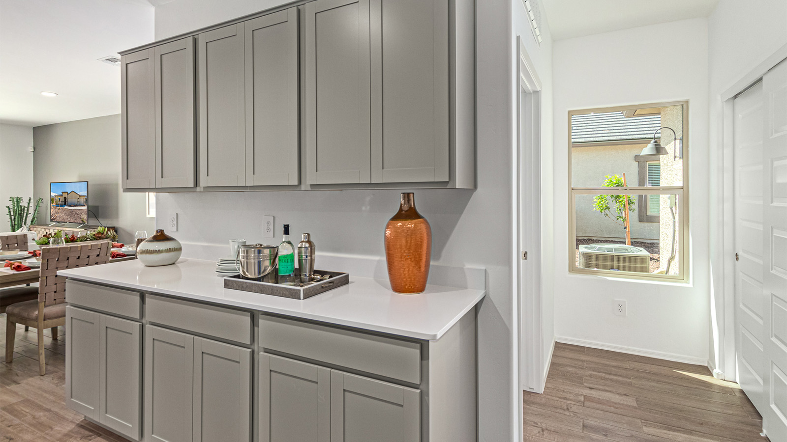 Introducing the Kingston at Entrada Del Toro  The Kingston is a spacious and thoughtfully designed single-story home located in the highly desirable Entrada Del Toro neighborhood within the master-planned community of Rancho Sahuarita. Offering 2,172 square feet of well-appointed living space, this inviting floor plan features four bedrooms, two full bathrooms, a grand kitchen island, a covered back patio, and a two-car garage—ideal for households seeking space, flexibility, and room to thrive.  From the moment you step inside, a welcoming entryway opens into an expansive open-concept layout that seamlessly connects the great room, dining area, and kitchen, creating a bright and airy space perfect for everyday living and effortless entertaining. The kitchen serves as the heart of the home, showcasing a large center island, Shaker-style cabinetry, quartz countertops, a walk-in pantry, and abundant storage for both function and style.  The Kingston features a well-planned split-bedroom design, with three secondary bedrooms located near the front of the home—ideal for family members, guests, home offices, or creative spaces. Privately situated at the rear of the home, the spacious primary suite offers a peaceful retreat complete with an en-suite bathroom and a generous walk-in closet.  *Images shown are for reference only. They depict the Kingston model home and may not represent the actual home.  Homes at Entrada Del Toro are designed with the future in mind. Exterior features include a light lace stucco finish, professionally landscaped front yards with automatic drip irrigation, and large, fully fenced backyards ready for your personal touch. Inside, the Home is Connected® Smart Home package provides modern convenience with a smart thermostat, video doorbell, keyless entry, and a Wi-Fi®–enabled garage door opener.  With its expansive living areas, flexible bedroom arrangement, and thoughtful design throughout, the Kingston delivers the perfect balance of comfort, convenience, and livability.  Residents of Entrada Del Toro enjoy access to Rancho Sahuarita’s extensive amenities, including a full-service fitness center, multiple resort-style swimming pools, pickleball courts, splash pads, playgrounds, and expansive parks designed for all ages and lifestyles. Homeowners will also enjoy exclusive access to the brand-new Entrada Del Toro Community Center, scheduled to open in Spring 2026, featuring modern gathering spaces and recreational amenities just moments from home.