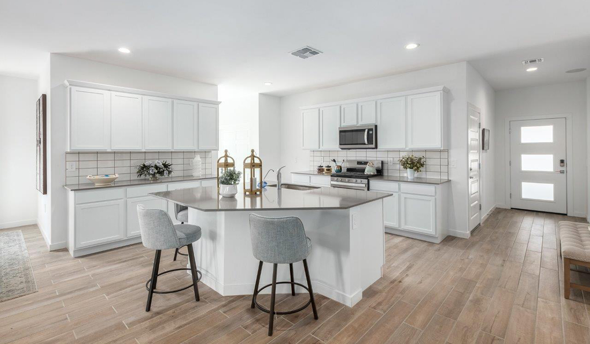 Introducing the Kingston at Entrada Del Toro  The Kingston is a spacious and thoughtfully designed single-story home located in the highly desirable Entrada Del Toro neighborhood within the master-planned community of Rancho Sahuarita. Offering 2,172 square feet of well-appointed living space, this inviting floor plan features four bedrooms, two full bathrooms, a grand kitchen island, a covered back patio, and a two-car garage—ideal for households seeking space, flexibility, and room to thrive.  From the moment you step inside, a welcoming entryway opens into an expansive open-concept layout that seamlessly connects the great room, dining area, and kitchen, creating a bright and airy space perfect for everyday living and effortless entertaining. The kitchen serves as the heart of the home, showcasing a large center island, Shaker-style cabinetry, quartz countertops, a walk-in pantry, and abundant storage for both function and style.  The Kingston features a well-planned split-bedroom design, with three secondary bedrooms located near the front of the home—ideal for family members, guests, home offices, or creative spaces. Privately situated at the rear of the home, the spacious primary suite offers a peaceful retreat complete with an en-suite bathroom and a generous walk-in closet.  *Images shown are for reference only. They depict the Kingston model home and may not represent the actual home.  Homes at Entrada Del Toro are designed with the future in mind. Exterior features include a light lace stucco finish, professionally landscaped front yards with automatic drip irrigation, and large, fully fenced backyards ready for your personal touch. Inside, the Home is Connected® Smart Home package provides modern convenience with a smart thermostat, video doorbell, keyless entry, and a Wi-Fi®–enabled garage door opener.  With its expansive living areas, flexible bedroom arrangement, and thoughtful design throughout, the Kingston delivers the perfect balance of comfort, convenience, and livability.  Residents of Entrada Del Toro enjoy access to Rancho Sahuarita’s extensive amenities, including a full-service fitness center, multiple resort-style swimming pools, pickleball courts, splash pads, playgrounds, and expansive parks designed for all ages and lifestyles. Homeowners will also enjoy exclusive access to the brand-new Entrada Del Toro Community Center, scheduled to open in Spring 2026, featuring modern gathering spaces and recreational amenities just moments from home.  *Images shown are for reference only. They depict The Kingston model home and may not represent the actual home.