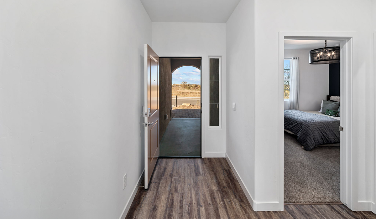 Introducing the Mariposa at Entrada Del Toro, a stunning single-story home within the master-planned community of Rancho Sahuarita.  This spacious and inviting home offers 1,897 sq. ft., four bedrooms, three full bathrooms, covered back patio, and two-car garage. This impressive layout is ideal for large households, multigenerational living, or anyone who simply wants room to grow, gather, and live comfortably.  A welcoming front porch leads you into the entryway, which flows into the expansive open-concept great room, dining area, and kitchen. The kitchen features a large center island, Shaker-style cabinetry, and plenty of storage space. With thoughtful design and abundant natural light this home welcoming.  One of the standout features of the Mariposa is the second bedroom that features an en-suite bathroom, perfect for multi-generational living, young adult, or a guest-style suite.  Our homes at Entrada Del Toro are designed with the future in mind. Each home features a light lace stucco exterior, landscaped front yards with auto drip irrigation, and large backyards that are fully fenced and ready for your personal touch. Inside, the Home is Connected® Smart Home package brings modern convenience to your fingertips with a smart thermostat, video doorbell, keyless entry, and a Wi-Fi® enabled garage door opener.  With its expansive living spaces, flexible bedroom arrangements, and thoughtful deign throughout, the Mariposa offers the ultimate combination of comfort, convenience, and room to thrive.  Residents of Entrada Del Toro will enjoy access to Rancho Sahuarita’s extensive amenity offerings, which include a full-service fitness center, multiple large swimming pools, pickle-ball courts, splash pads, playgrounds, and sizable parks and recreational spaces designed for all ages and lifestyles. In addition, homeowners will have exclusive access to the brand-new Entrada Del Toro Community Center, scheduled to open Spring 2026, further enhancing the neighborhood experience with modern gathering and recreational spaces close to home.