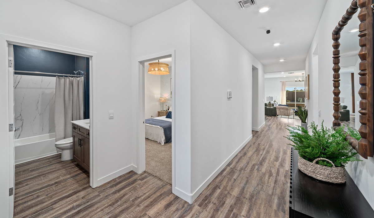 Introducing the Mariposa at Entrada Del Toro, a stunning single-story home within the master-planned community of Rancho Sahuarita.  This spacious and inviting home offers 1,897 sq. ft., four bedrooms, three full bathrooms, covered back patio, and two-car garage. This impressive layout is ideal for large households, multigenerational living, or anyone who simply wants room to grow, gather, and live comfortably.  A welcoming front porch leads you into the entryway, which flows into the expansive open-concept great room, dining area, and kitchen. The kitchen features a large center island, Shaker-style cabinetry, and plenty of storage space. With thoughtful design and abundant natural light this home welcoming.  One of the standout features of the Mariposa is the second bedroom that features an en-suite bathroom, perfect for multi-generational living, young adult, or a guest-style suite.  Our homes at Entrada Del Toro are designed with the future in mind. Each home features a light lace stucco exterior, landscaped front yards with auto drip irrigation, and large backyards that are fully fenced and ready for your personal touch. Inside, the Home is Connected® Smart Home package brings modern convenience to your fingertips with a smart thermostat, video doorbell, keyless entry, and a Wi-Fi® enabled garage door opener.  With its expansive living spaces, flexible bedroom arrangements, and thoughtful deign throughout, the Mariposa offers the ultimate combination of comfort, convenience, and room to thrive.  Residents of Entrada Del Toro will enjoy access to Rancho Sahuarita’s extensive amenity offerings, which include a full-service fitness center, multiple large swimming pools, pickle-ball courts, splash pads, playgrounds, and sizable parks and recreational spaces designed for all ages and lifestyles. In addition, homeowners will have exclusive access to the brand-new Entrada Del Toro Community Center, scheduled to open Spring 2026, further enhancing the neighborhood experience with modern gathering and recreational spaces close to home.