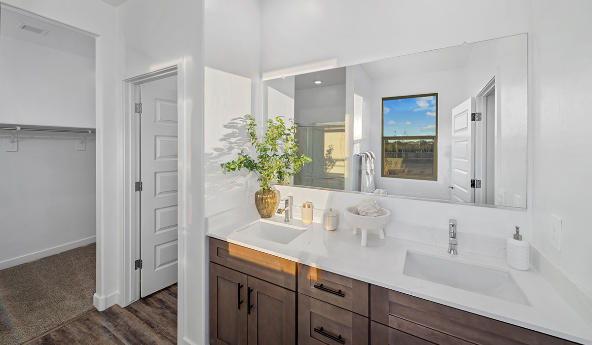 Introducing the Mariposa at Entrada Del Toro, a stunning single-story home within the master-planned community of Rancho Sahuarita.  This spacious and inviting home offers 1,897 sq. ft., four bedrooms, three full bathrooms, covered back patio, and two-car garage. This impressive layout is ideal for large households, multigenerational living, or anyone who simply wants room to grow, gather, and live comfortably.  A welcoming front porch leads you into the entryway, which flows into the expansive open-concept great room, dining area, and kitchen. The kitchen features a large center island, Shaker-style cabinetry, and plenty of storage space. With thoughtful design and abundant natural light this home welcoming.  One of the standout features of the Mariposa is the second bedroom that features an en-suite bathroom, perfect for multi-generational living, young adult, or a guest-style suite.  Our homes at Entrada Del Toro are designed with the future in mind. Each home features a light lace stucco exterior, landscaped front yards with auto drip irrigation, and large backyards that are fully fenced and ready for your personal touch. Inside, the Home is Connected® Smart Home package brings modern convenience to your fingertips with a smart thermostat, video doorbell, keyless entry, and a Wi-Fi® enabled garage door opener.  With its expansive living spaces, flexible bedroom arrangements, and thoughtful deign throughout, the Mariposa offers the ultimate combination of comfort, convenience, and room to thrive.  Residents of Entrada Del Toro will enjoy access to Rancho Sahuarita’s extensive amenity offerings, which include a full-service fitness center, multiple large swimming pools, pickle-ball courts, splash pads, playgrounds, and sizable parks and recreational spaces designed for all ages and lifestyles. In addition, homeowners will have exclusive access to the brand-new Entrada Del Toro Community Center, scheduled to open Spring 2026, further enhancing the neighborhood experience with modern gathering and recreational spaces close to home.