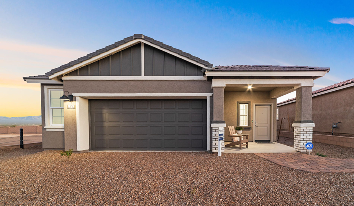 Introducing the Carolina — a thoughtfully designed single-story home offering 1,608 sq. ft. of modern comfort at Entrada Del Toro, a master-planned community in Rancho Sahuarita.  With three bedrooms, two full bathrooms, and a two-car garage, this efficient and beautifully planned layout is perfect for those seeking convenience, comfort, and single-level living.  A welcoming front porch invites you inside, where the entryway opens into a bright and beautifully crafted living space. The heart of the home is the well-appointed kitchen, featuring a large center island, walk-in pantry, and stylish Shaker-style cabinetry. Overlooking the dining area and great room, this open layout makes it easy to cook, gather, and entertain with ease.  The primary bedroom is thoughtfully positioned at the rear of the home, creating a private retreat. Complete with a large en-suite bathroom and walk-in closet, it’s designed for relaxation and convenience.  Two additional bedrooms are located toward the front of the home, offering flexibility for family, guests, a home office, or hobbies, and share a full secondary hallway bathroom.  Our homes at Entrada Del Toro are designed with the future in mind. Each home features a light lace stucco exterior, landscaped front yards with auto drip irrigation, and large backyards that are fully fenced and ready for your personal touch. Inside, the Home is Connected® Smart Home package brings modern convenience to your fingertips with a smart thermostat, video doorbell, keyless entry, and a Wi-Fi® enabled garage door opener.  With its smart layout, modern features, and effortless single-story living, the Carolina brings comfort and functionality together in a one beautifully designed home here at Entrada Del Toro.  Residents of Entrada Del Toro will enjoy access to Rancho Sahuarita’s extensive amenity offerings, which include a full-service fitness center, multiple large swimming pools, pickle-ball courts, splash pads, playgrounds, and sizable parks and recreational spaces designed for all ages and lifestyles. In addition, homeowners will have exclusive access to the brand-new Entrada Del Toro Community Center, scheduled to open Spring 2026, further enhancing the neighborhood experience with modern gathering and recreational spaces close to home.