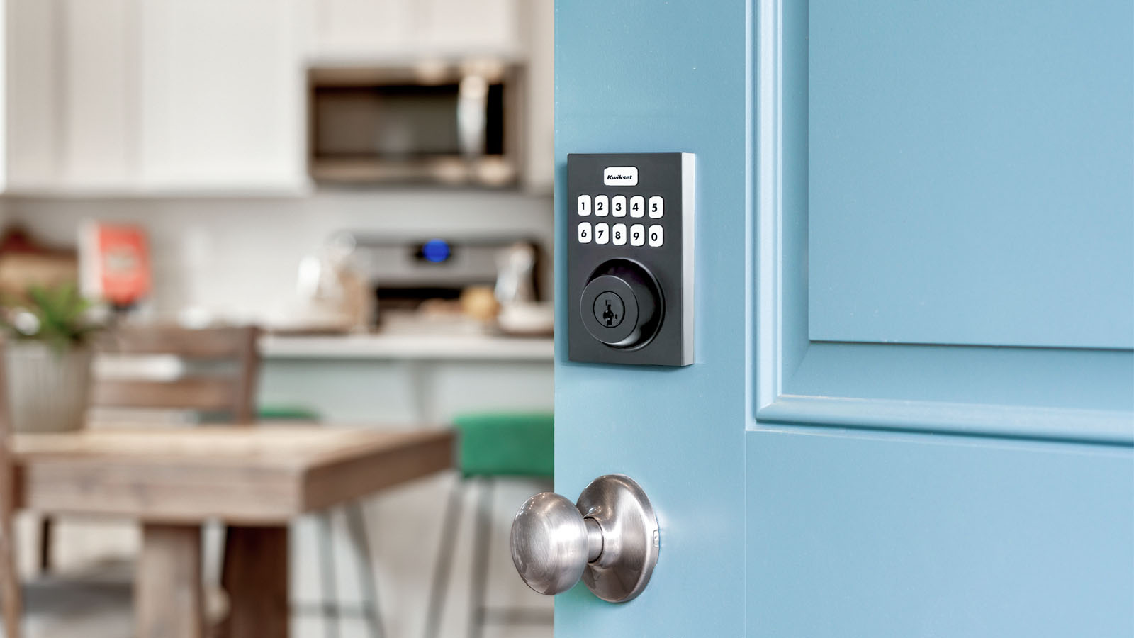 Blue door with featuring Kwikset deadbold with keypad.