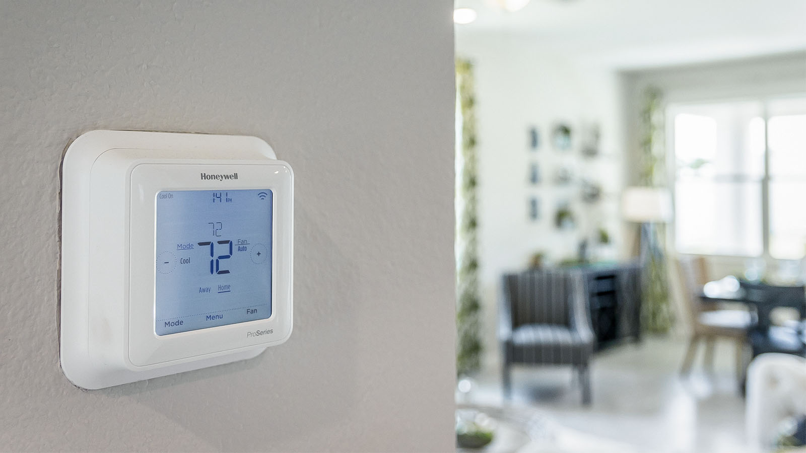 Closeup view of a Honeywell ProSeries smart wall thermostat