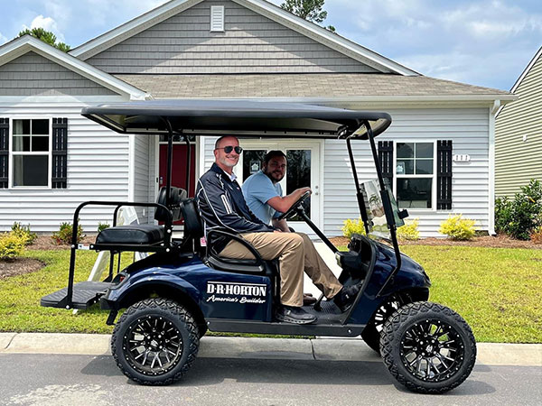 DR Horton golf cart and riders